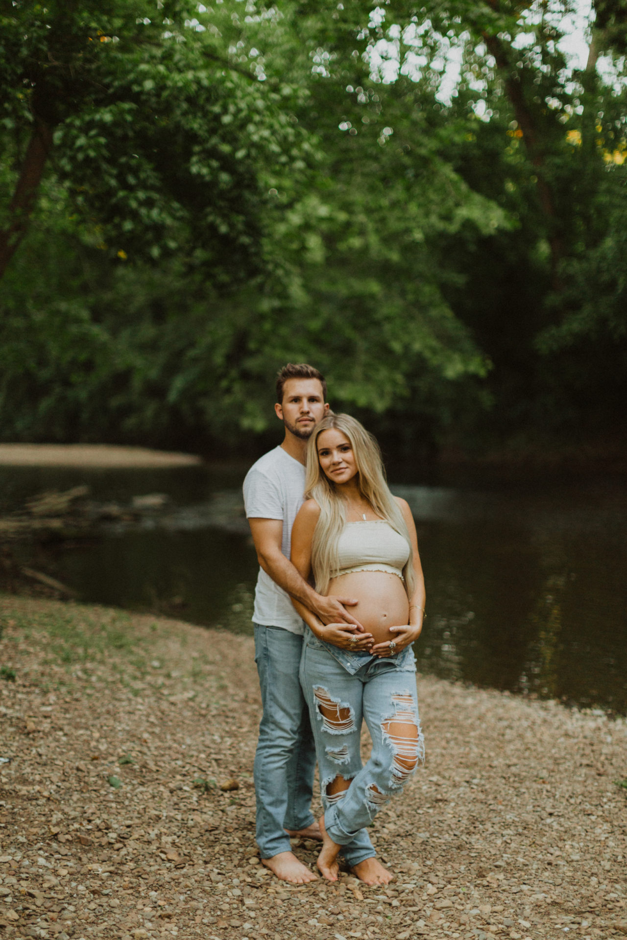 his and hers outdoor maternity shoot in a creek