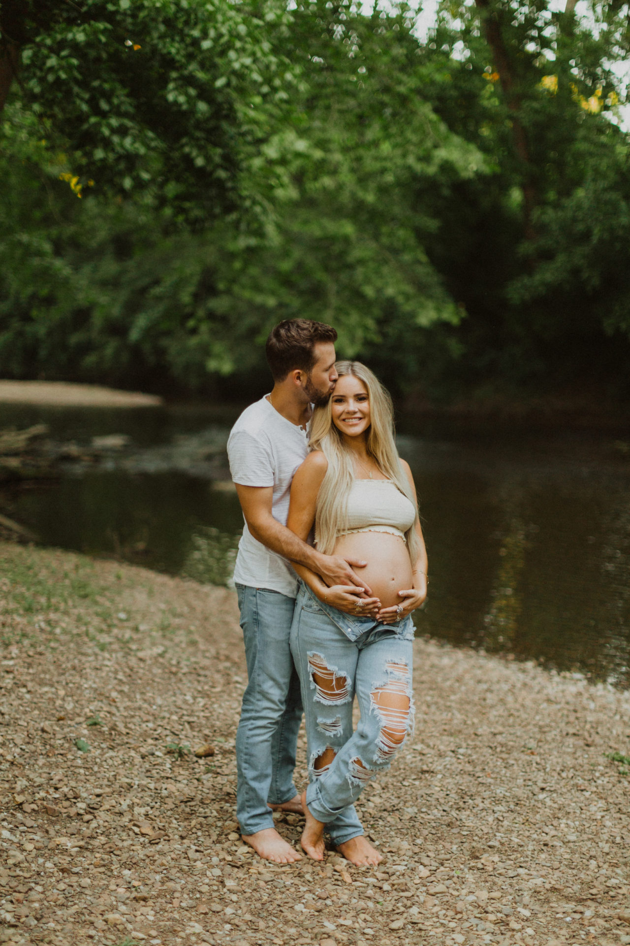 his and hers outdoor maternity shoot in a creek