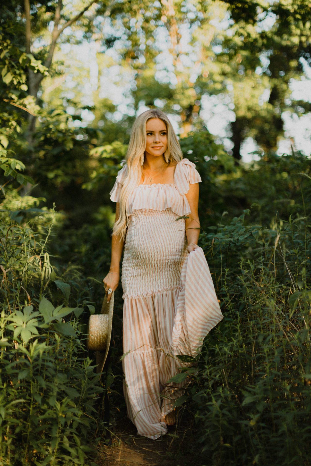 glowing maternity shoot with wild flowers